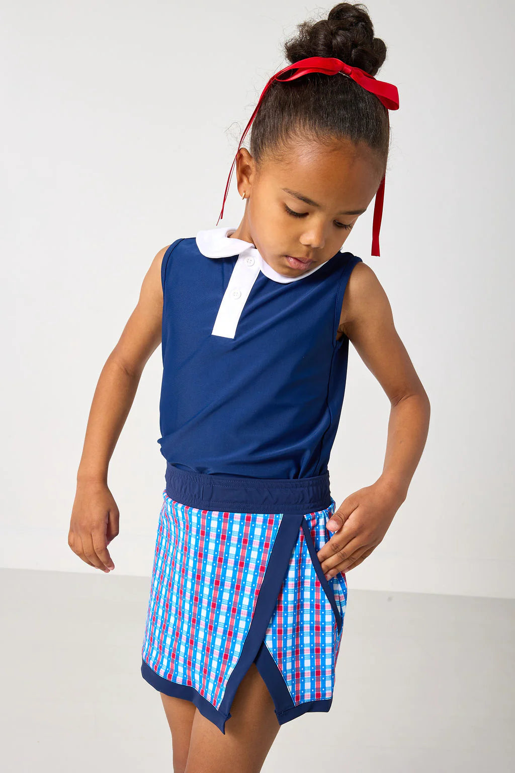 Red, white, and gingham retro power skort for kids by Courtside Kids, featuring a stylish casual design and sporty look.