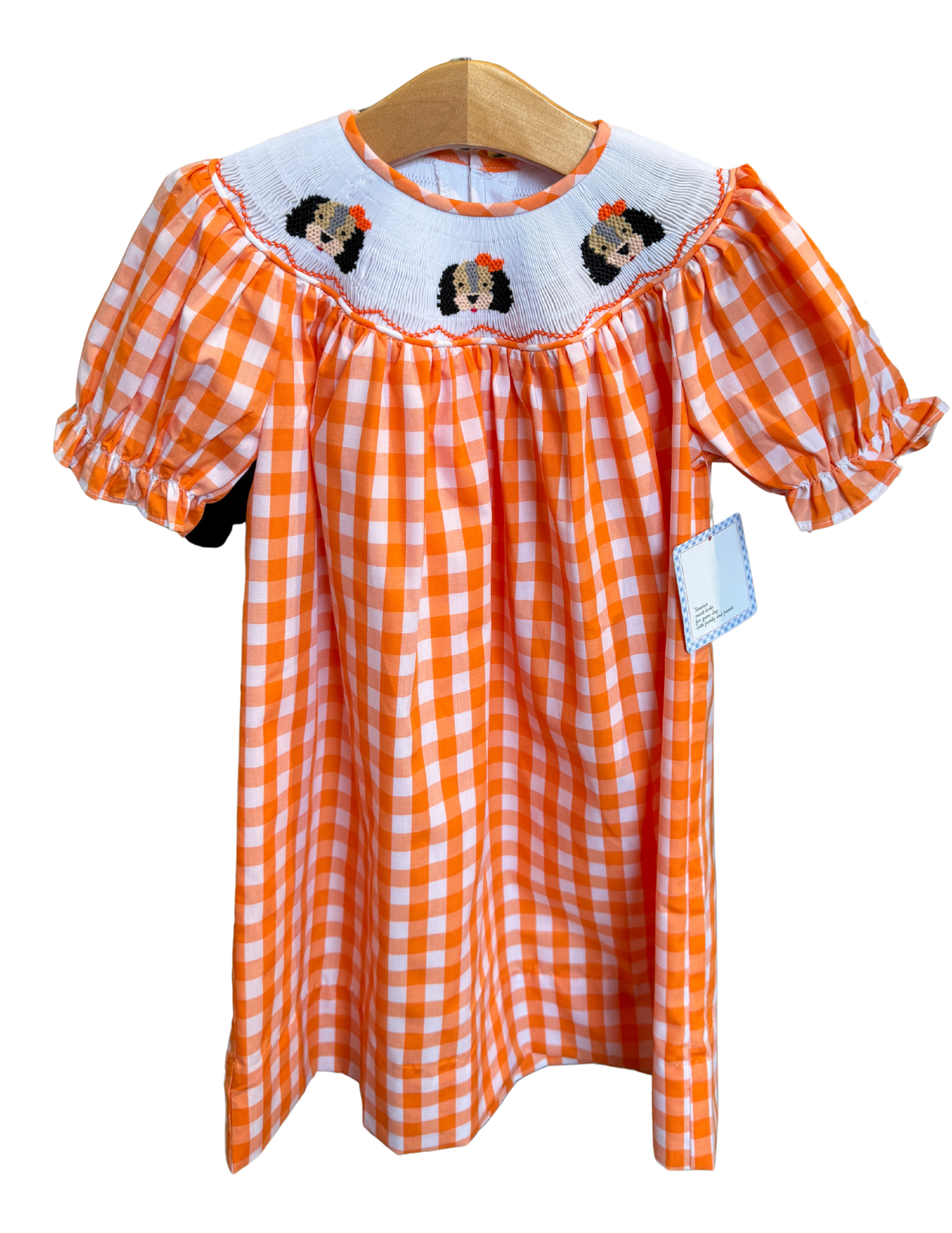 Orange and white gingham smocked smokey bishop dress by Remember Nguyen, featuring a classic pattern and puffed sleeves.