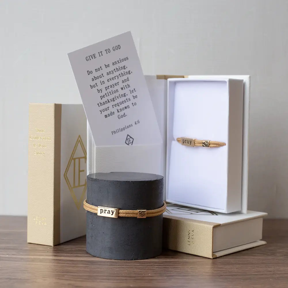 Lenny & Eva Sentiment Cord Bracelet with Pray Philippians 4:6 engraved, featuring a black cord and silver-tone charm with inspirational message.