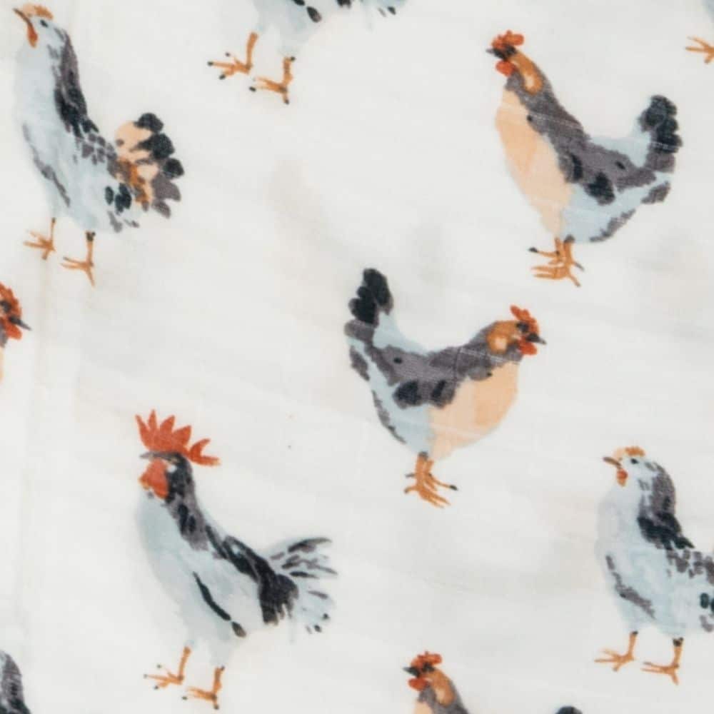 Organic chicken-print swaddle blanket for babies by Milkbarn, featuring soft, breathable fabric with cute chicken illustrations.