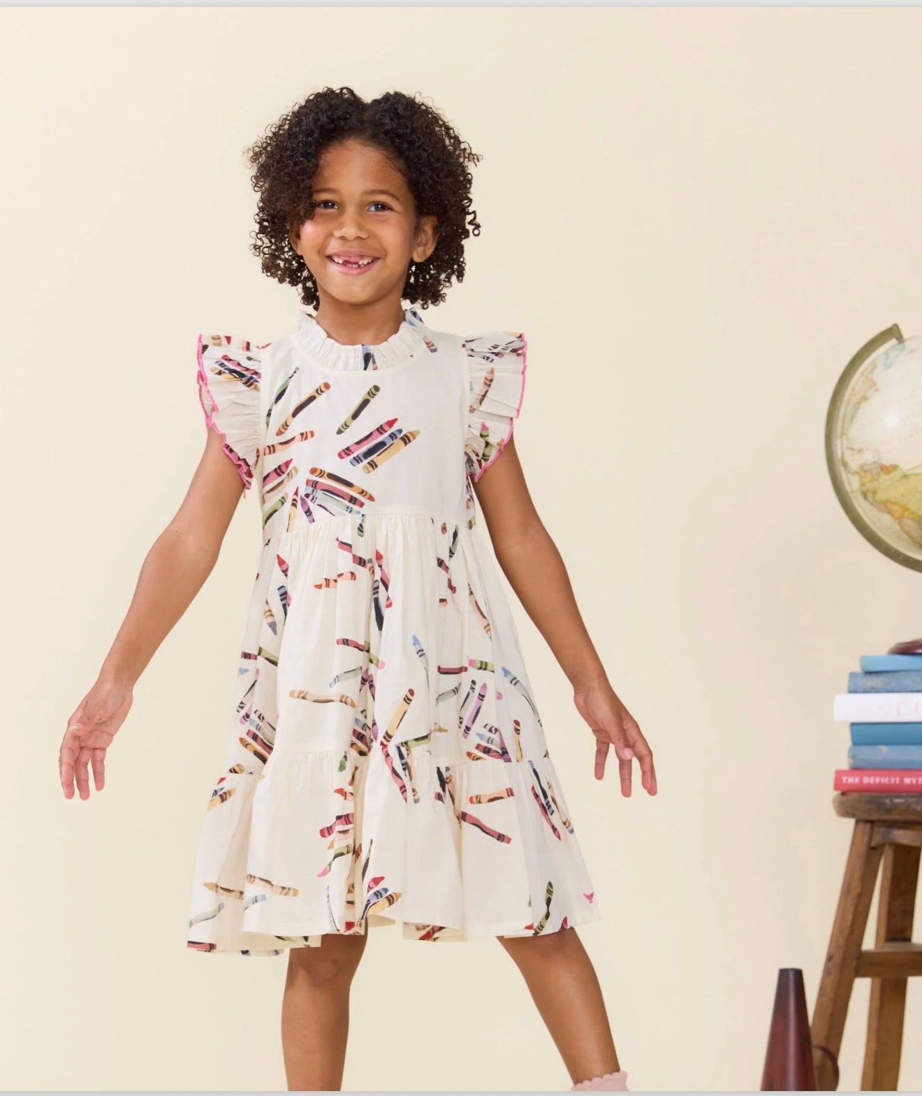 Pink Chicken Tossed Crayons Jennifer Dress displayed on a model, featuring a colorful, playful design perfect for young girls.