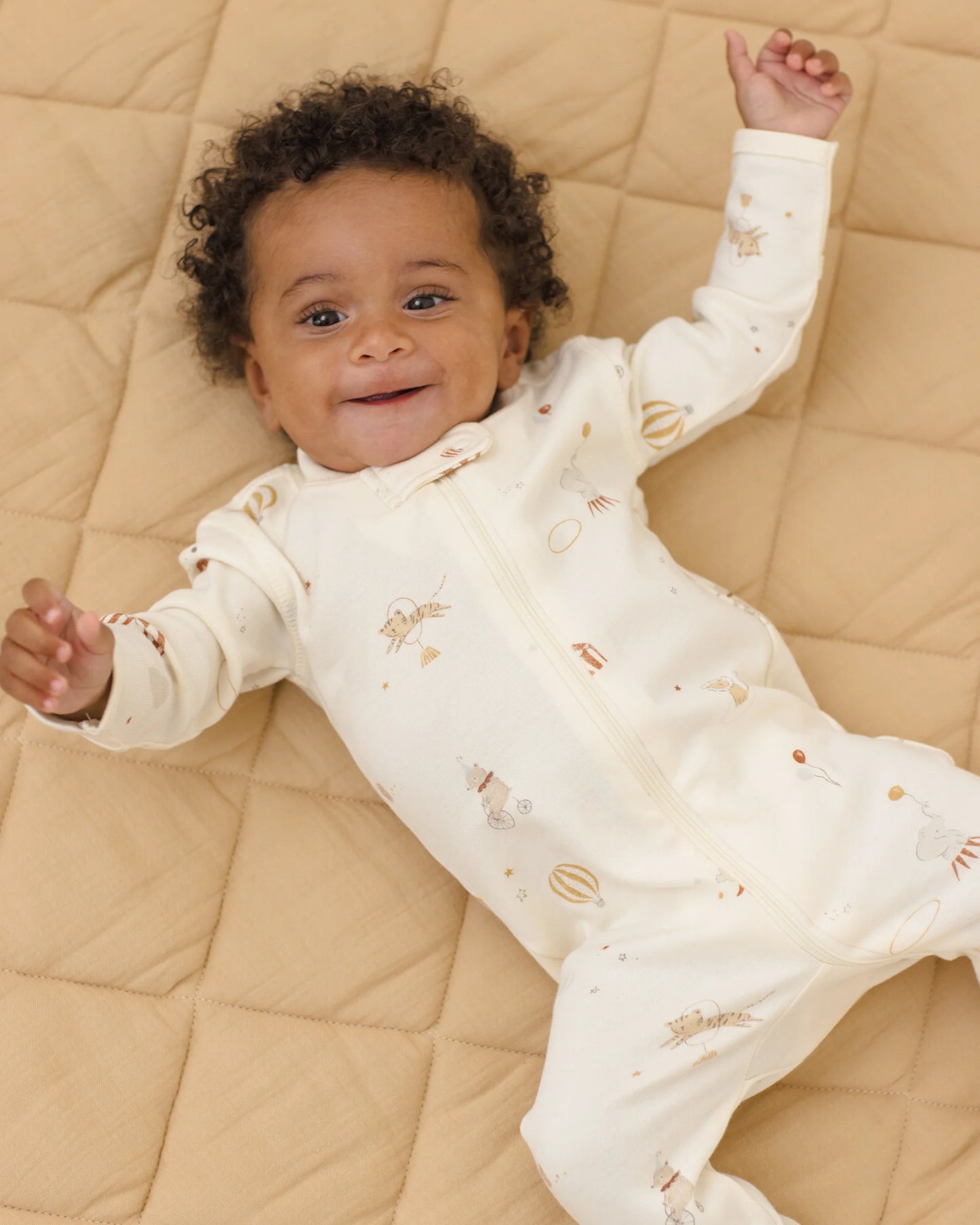 Quincy Mae Carnival Zip long sleeve sleeper footie in soft fabric, featuring a cozy design and front zipper for easy dressing.