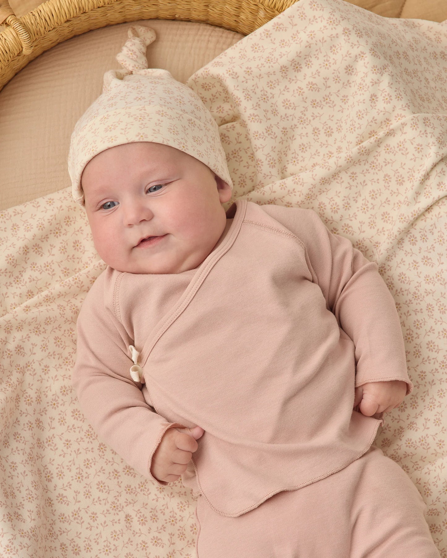 Quincy Mae Ditsy Knotted Baby Hat in soft fabric with a cute knotted top and a delicate ditsy print, perfect for infants.
