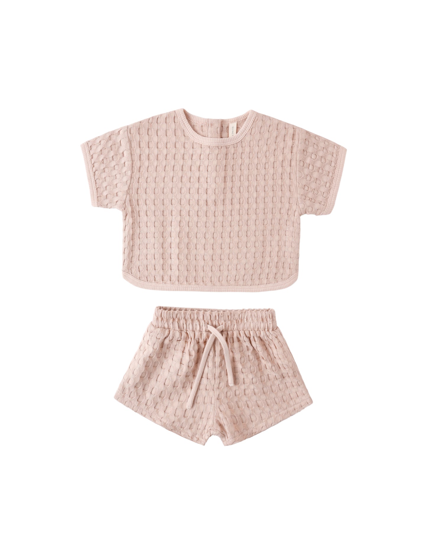 Soft blush Jayden set by Quincy Mae, featuring a cozy, stylish clothing ensemble for children, displayed on a hanger.