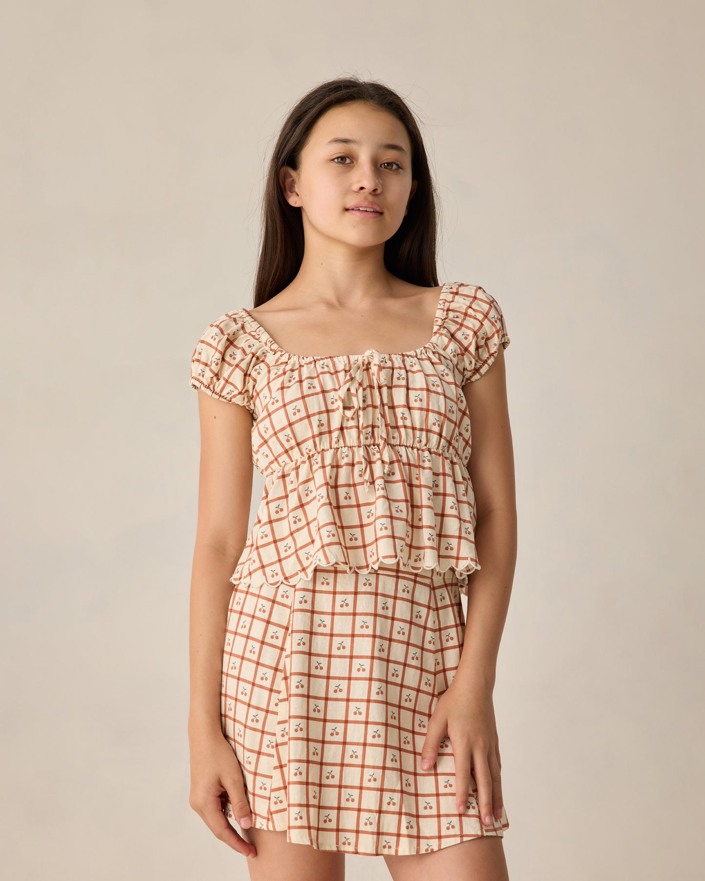 Teen Cherry Check Rylan Top by Rylee & Cru, featuring a stylish cherry plaid pattern and casual fit, perfect for teens.
