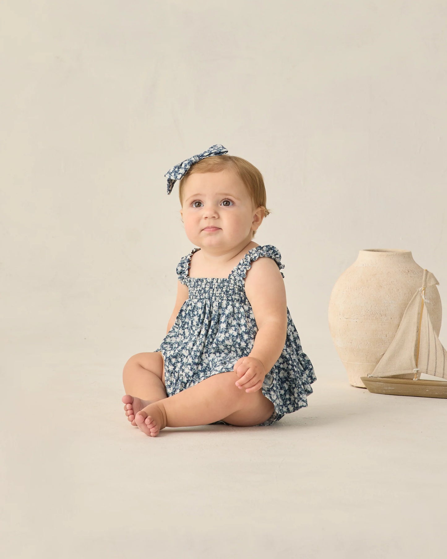 Navy floral Lala set from Rylee & Cru featuring a top and matching bottoms with a cheerful floral pattern.