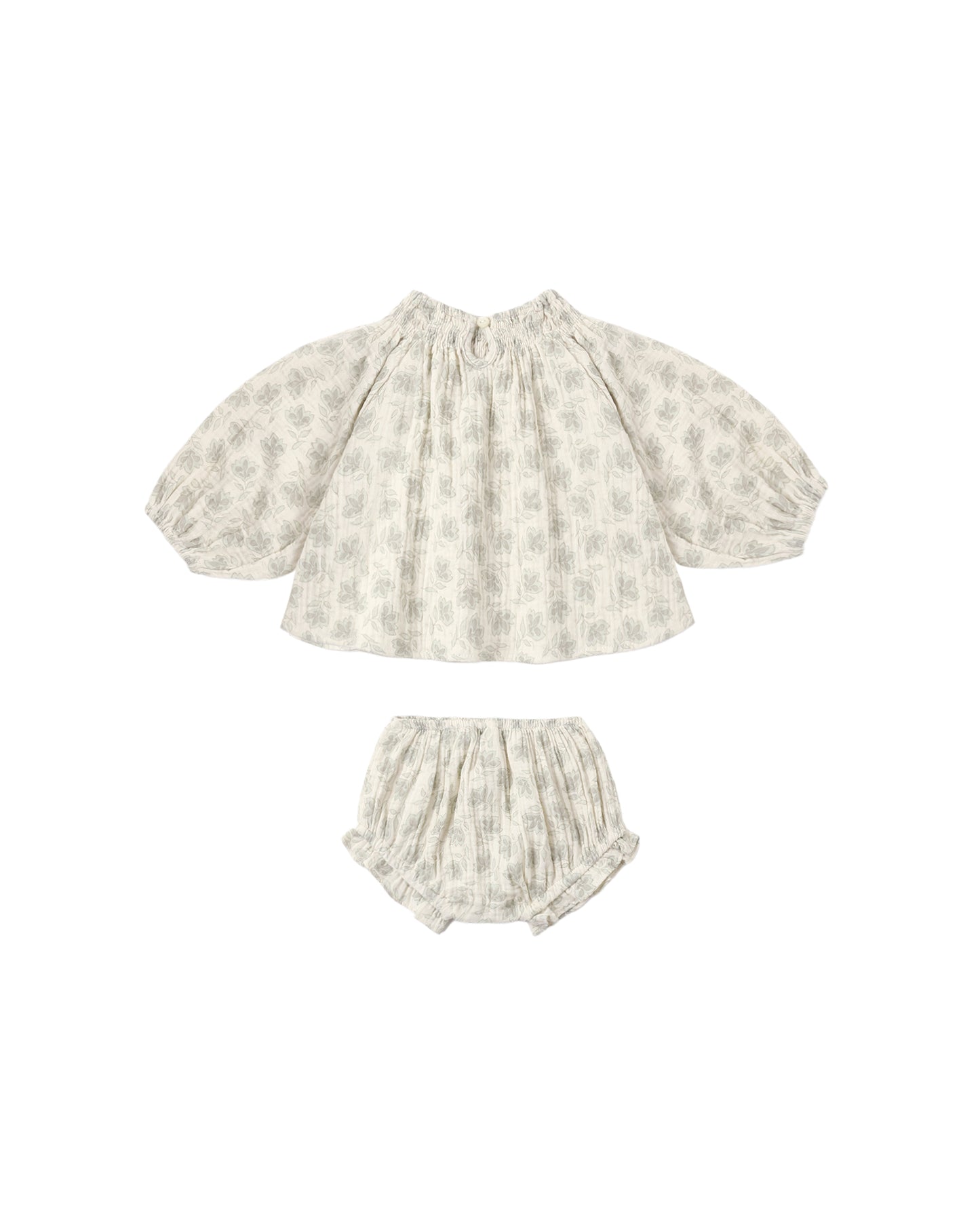 Green Iris Quincy set by Rylee & Cru featuring a natural-colored fabric with detailed stitching and charming design elements.