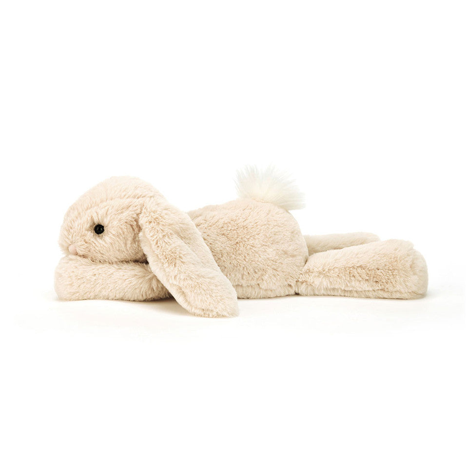 Jellycat Smudge Rabbit Original plush toy with soft gray fur and floppy ears, lying on a white background.