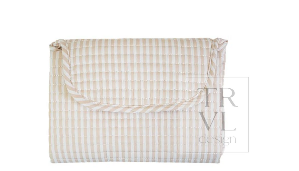 Quilted changing mat by TRVL Designs featuring soft padding and a sleek, durable surface for comfortable baby diaper changes.