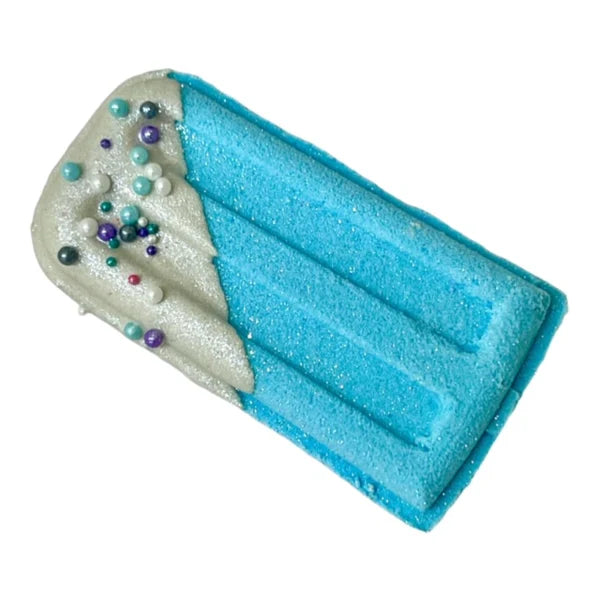 Blue Popsicle Prize Bath Bomb by The Lavish Goat, square-shaped, vibrant blue with colorful sprinkles inside.