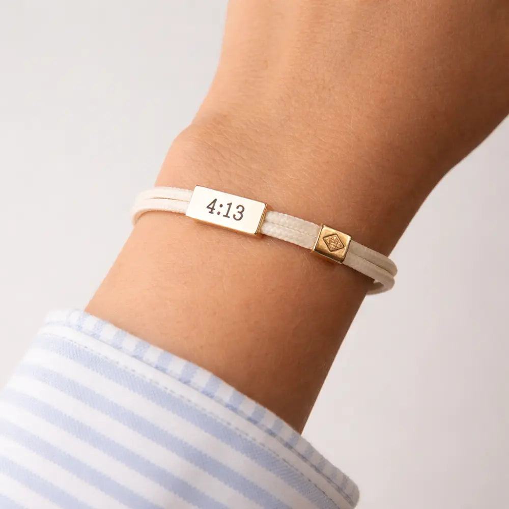 Lenny & Eva Sentiment Cord Bracelet with Philippians 4:13 "You've Got This" inscription on a beige cord bracelet.
