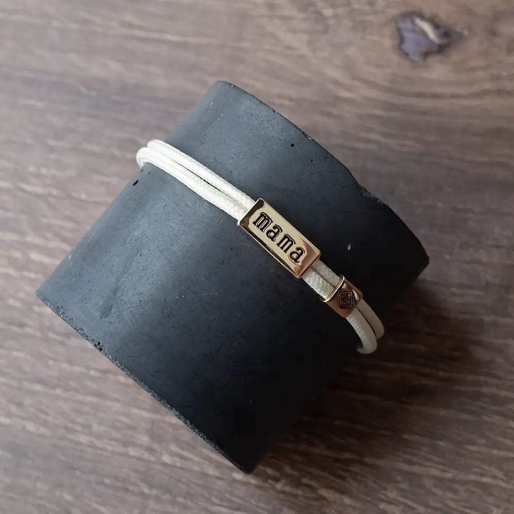 Lenny & Eva Sentiment Cord Bracelet-Mama in ivory with delicate adjustable cord and subtle charm detailing