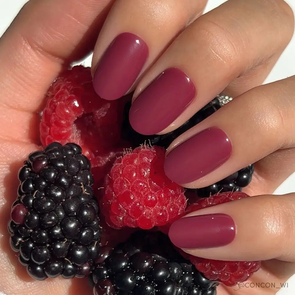 Glamnetic Berry Maroon press-on nails with a glossy finish and almond shape, displayed on a neutral background.