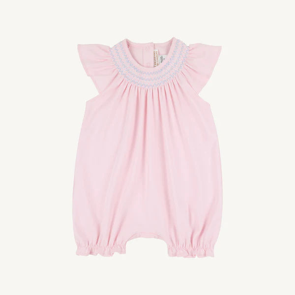 Pink and blue sandy smocked romper for babies by The Beaufort Bonnet Company, featuring Palm Beach pink and Beale Street blue details.