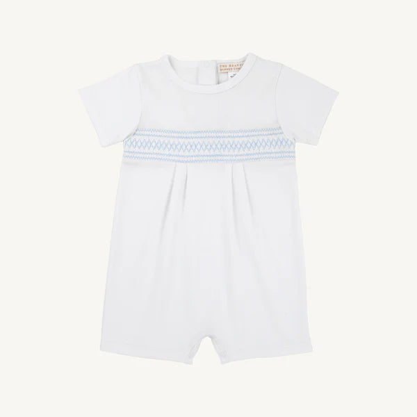 Baby girl wearing the Worth Ave Sebastian Smocked Romper by The Beaufort Bonnet Company, featuring white and Beale Street Blue colors.