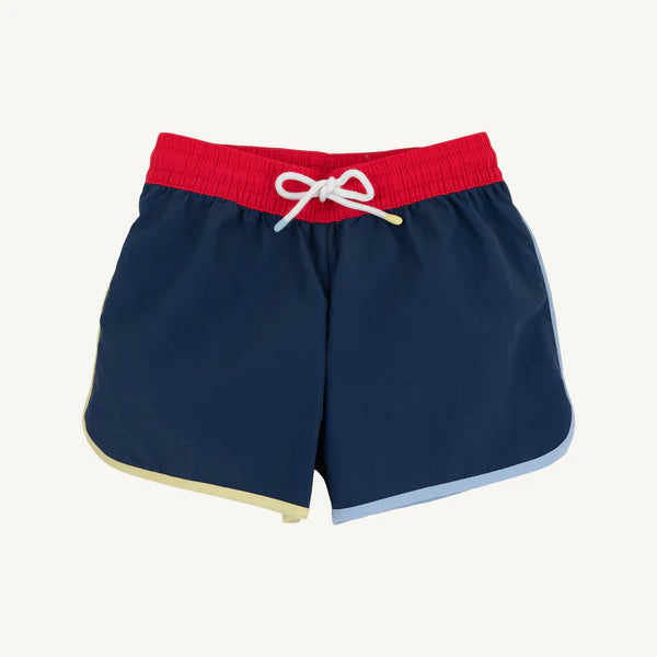 Beaufort Bonnet Company Tanner Trunks in Nantucket Navy, Richmond Red, Beale Street Blue, and Lake Worth Yellow, colorful and stylish.