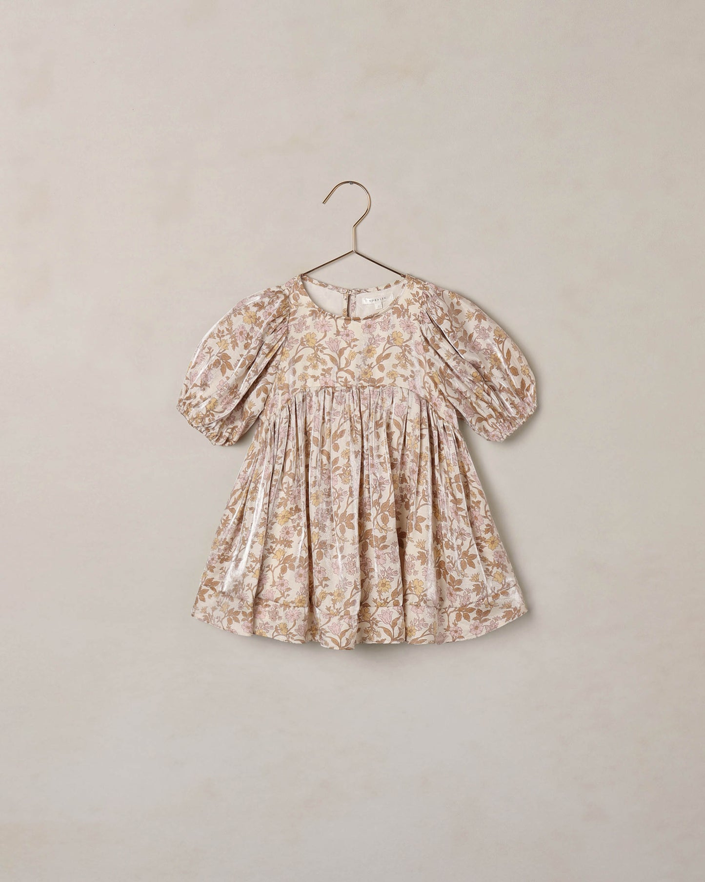 Wildflower Luna Dress by Noralee featuring a floral pattern and flowing fabric, displayed on a mannequin.