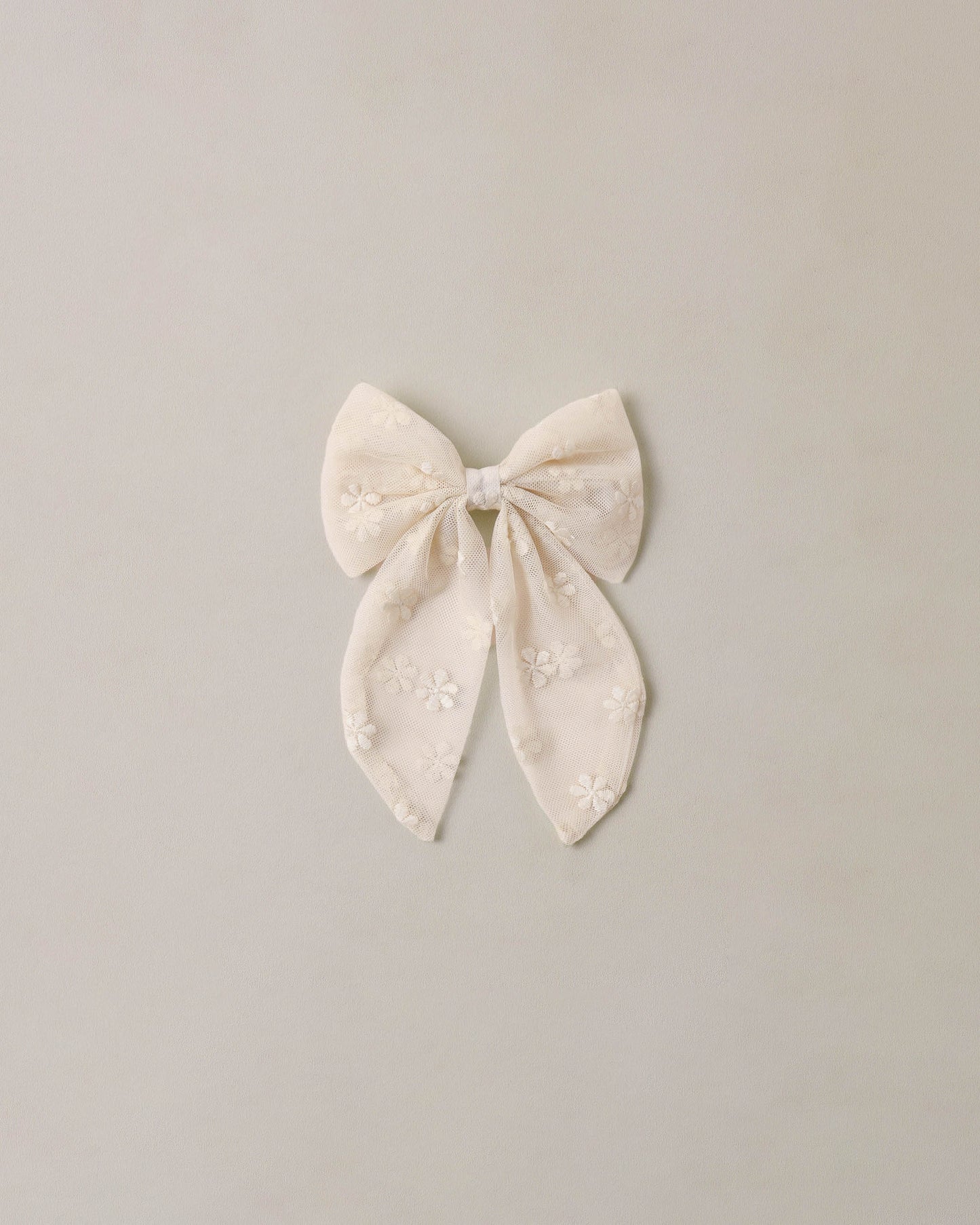 Noralee embroidered Daisy Everly Bow featuring delicate floral embroidery and a stylish hair accessory design.
