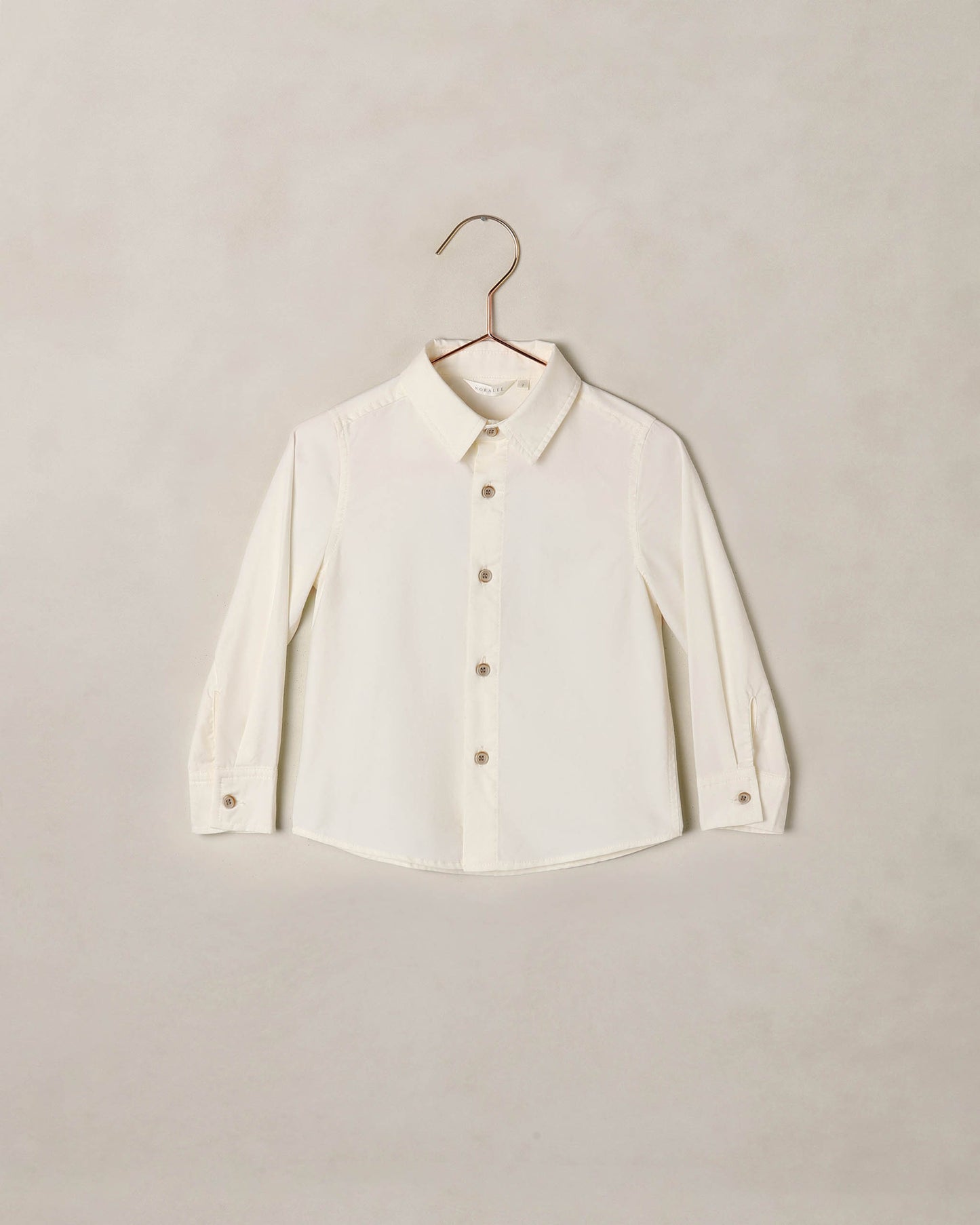Ivory Noralee Harrison button-down shirt with collar and long sleeves, displayed flat on a white background.