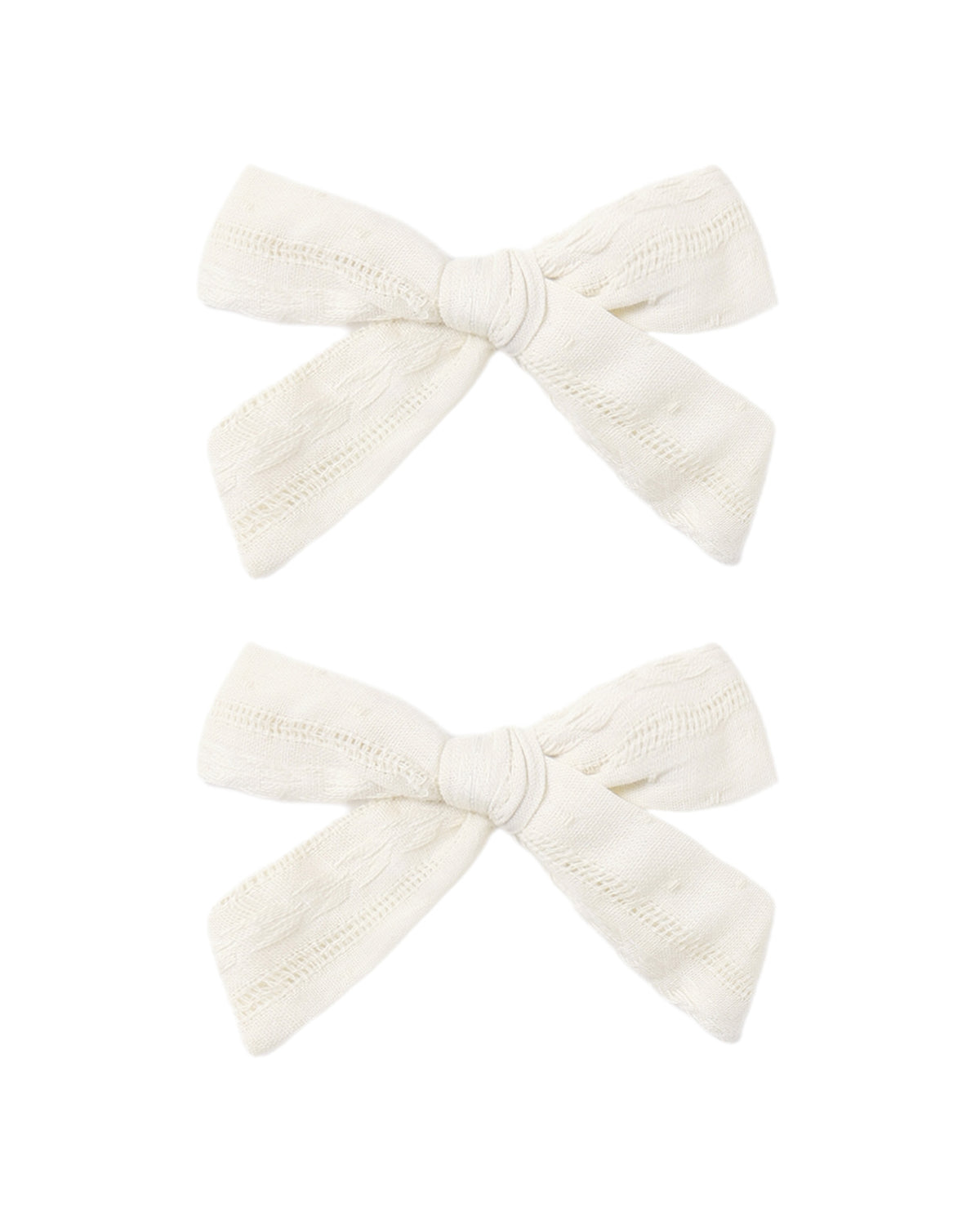 Set of two ivory bows from Rylee & Cru, featuring soft fabric and adorable, versatile hair accessories for children.
