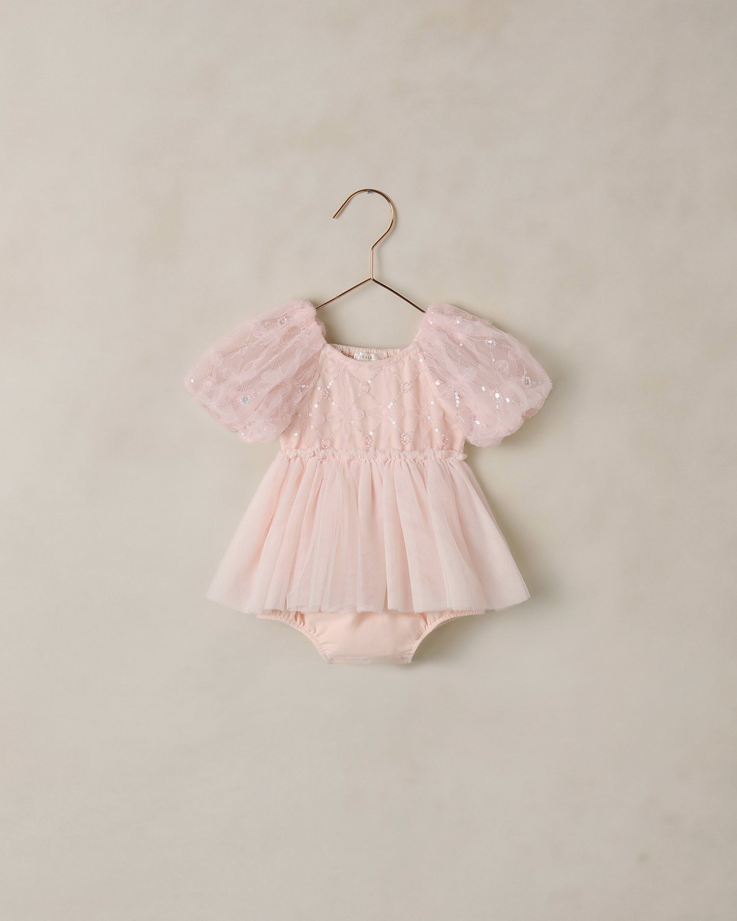 Pink blush Dorothy Tutu from Noralee featuring soft tulle layers and a delicate waistband, perfect for dance or special occasions.