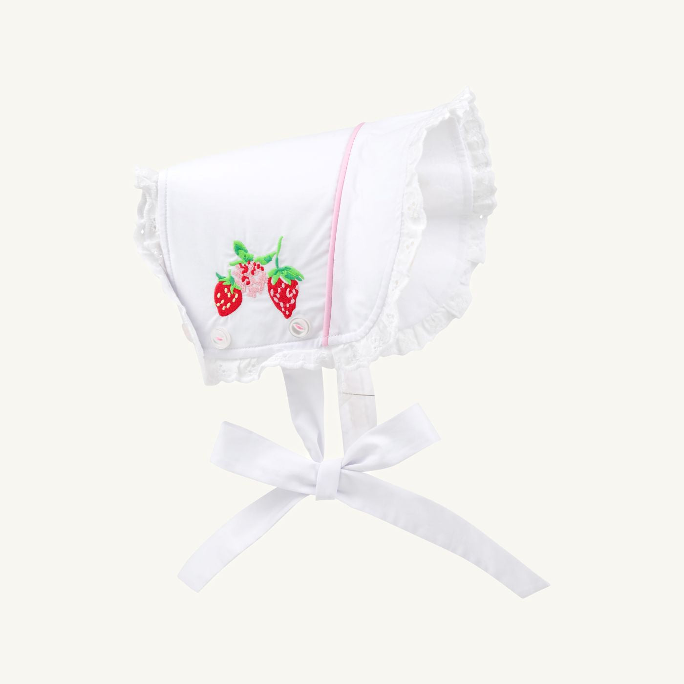 White and pink Catesby Country Club bonnet by The Beaufort Bonnet Company featuring a strawberry pattern and soft fabric.