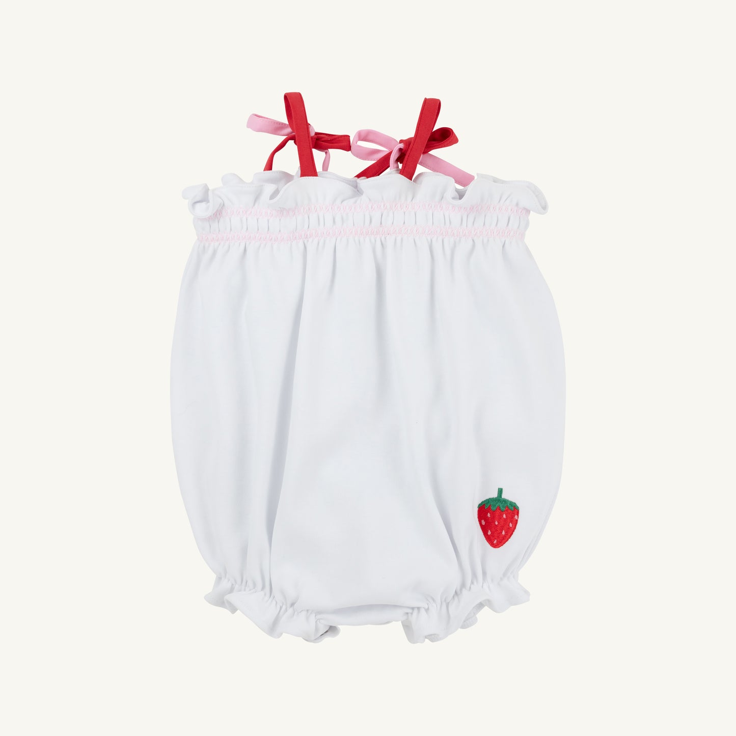 Baby girl wearing the Worth Ave Rosey Romper by The Beaufort Bonnet Company featuring white, pink, and red floral patterns.