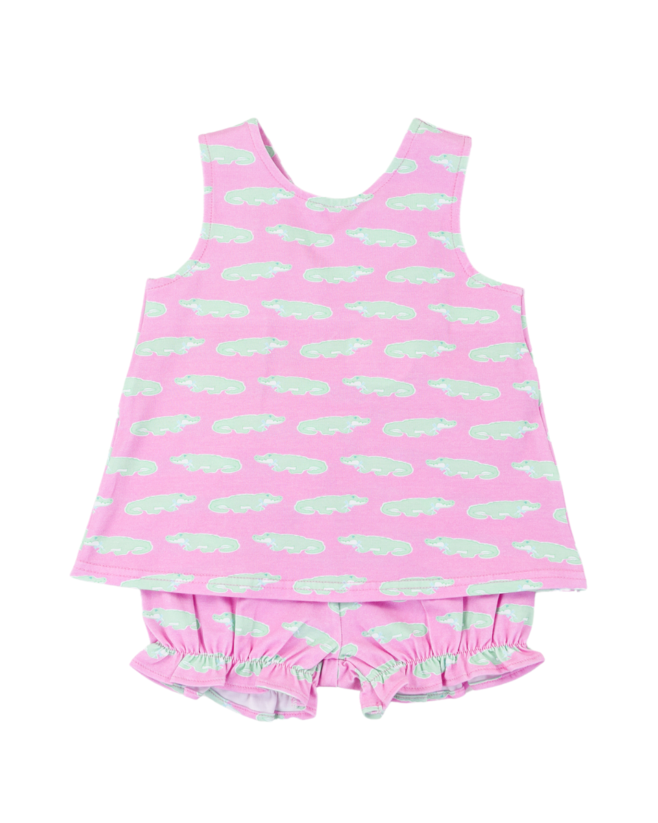 Little girl wearing Cypress Row Snappy Cassidy Crossover Set with colorful patterns and soft fabric, front view.