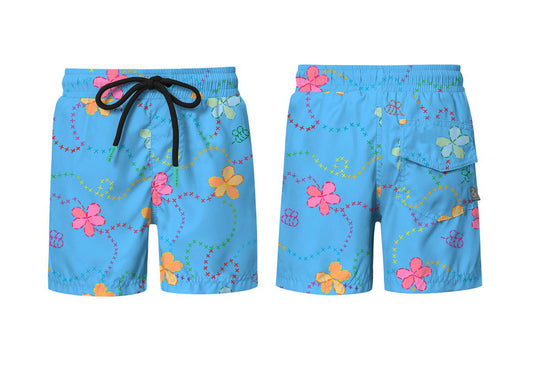 Pepita & Me Piglo Azul swimshorts with elastic waistband and colorful pattern, suitable for kids' beach or pool wear.