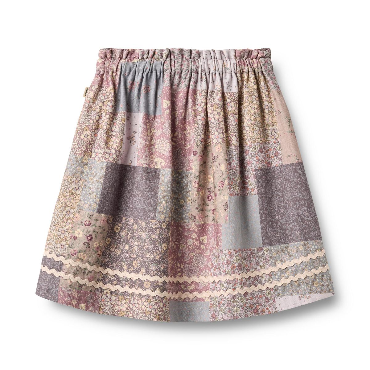 Wheat Patchwork Flowers Nya Skirt featuring colorful floral patchwork fabric and a stylish, casual design.