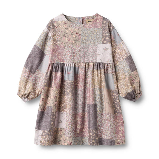 Wheat Patchwork Flowers Herdis long-sleeve dress featuring colorful floral patchwork design and a comfortable fit.