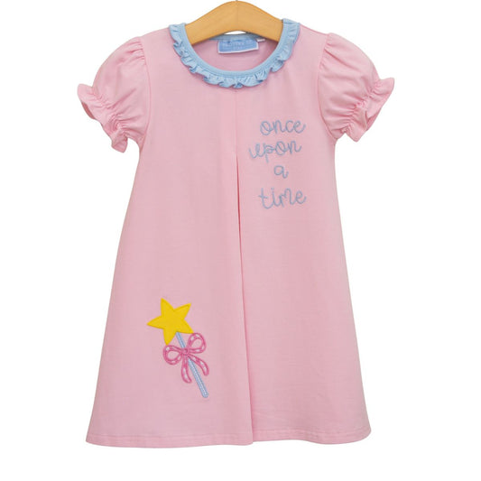 Trotter Street Once Upon A Time dress shown on a hanger, featuring a whimsical design with floral patterns and soft fabric.