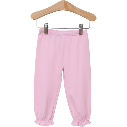 Light pink ruffle bloomer pants for babies by Trotter Street, featuring soft fabric and decorative ruffles on the waistband.