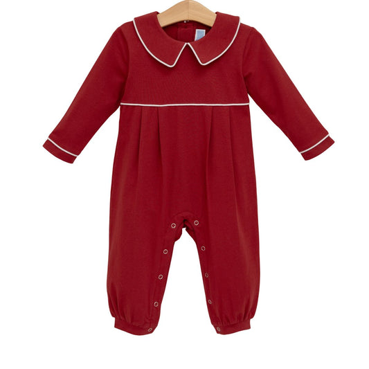 Burgundy Joseph Romper by Trotter Street featuring short sleeves, button closure, and a relaxed fit on a mannequin.