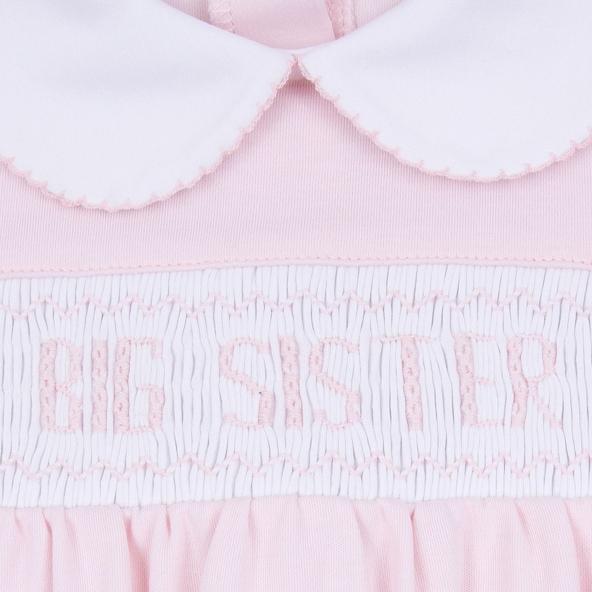 Pink Magnolia Baby big sister smocked short-sleeve toddler dress with ruffled details and comfortable fit.
