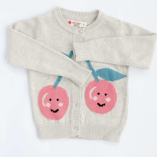 Bright red Happy Cherry cardigan by Good Apples featuring a cozy knit fabric and cherry pattern, displayed on a hanger.