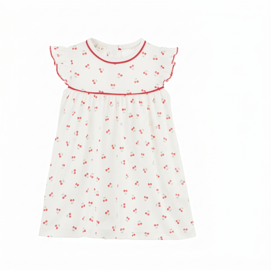 Toddler girl wearing the Cherry Grove Ivory Flutters Dress by Luna + Arlo, featuring ruffled sleeves and floral details.