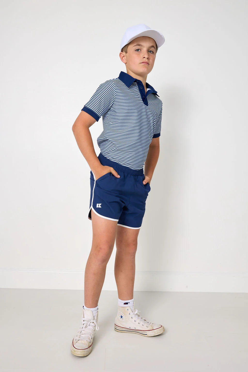 Navy retro super shorts with white piping for kids, by Courtside Kids, featuring a stylish athletic design and comfortable fit.