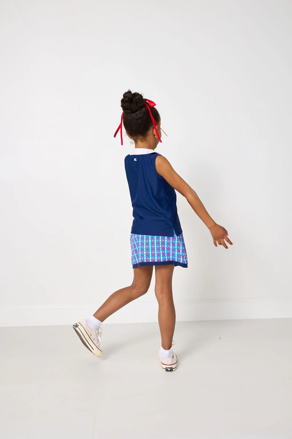 Red, white, and gingham retro power skort for kids by Courtside Kids, featuring a stylish, sporty design with a comfortable fit.