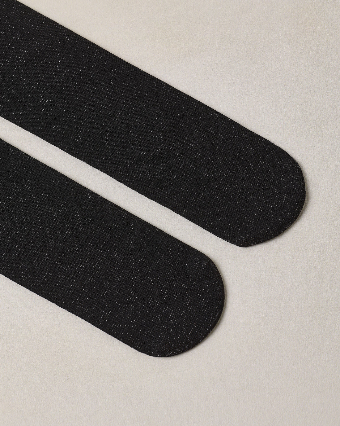 Black and blush shimmer tights by Noralee featuring a sleek, shiny design with a subtle shimmer finish.