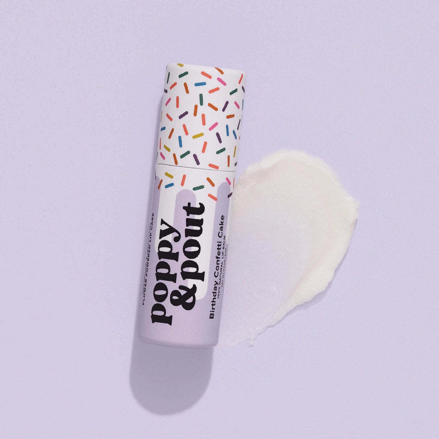 Sweet E's Children's Boutique Poppy & Pout lip balm in a colorful container, designed for children's lip care and hydration.