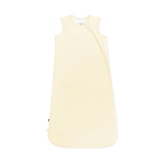 Kyte Baby Sleep Bag in Chamomile 1.0, soft and cozy wearable blanket for babies, with a gentle chamomile color and secure zipper closure.