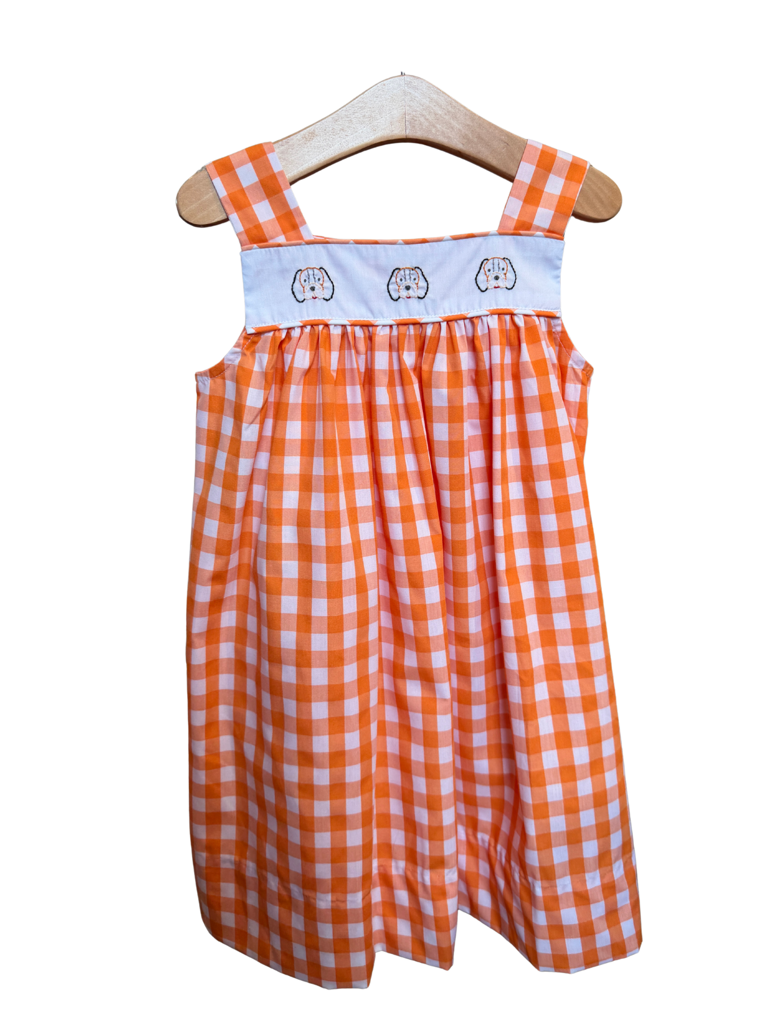 Orange and white gingham embroidered dress with smoky face design by Remember Nguyen, featuring a stylish, casual look.