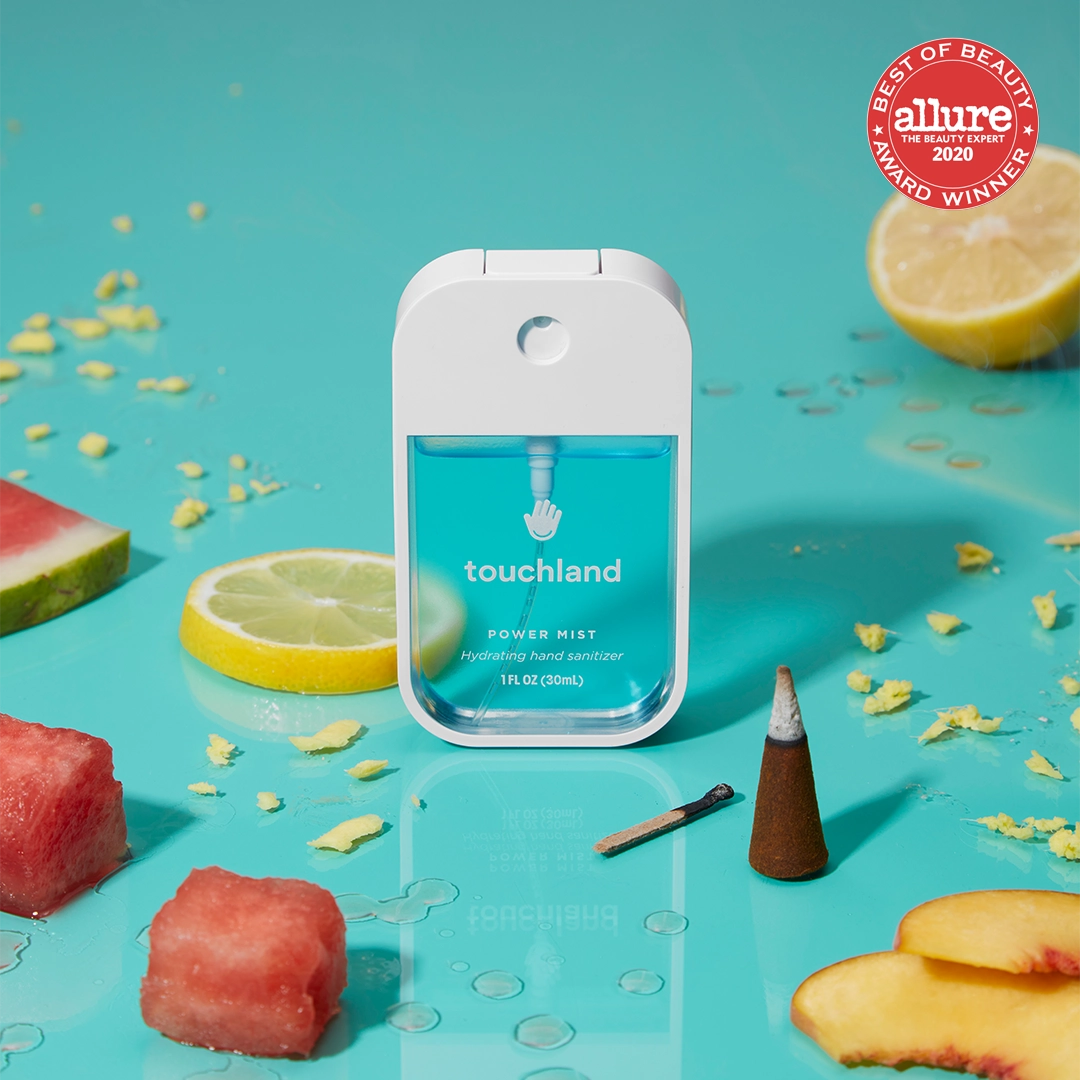 Touchland Powermists hand sanitizer spray bottle with sleek design and clear label, compact and portable for on-the-go use.