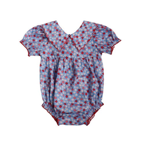 Blue Ditsy Floral Conley Bubble dress by Hollis Baker, showing a close-up of the lightweight fabric and floral pattern.
