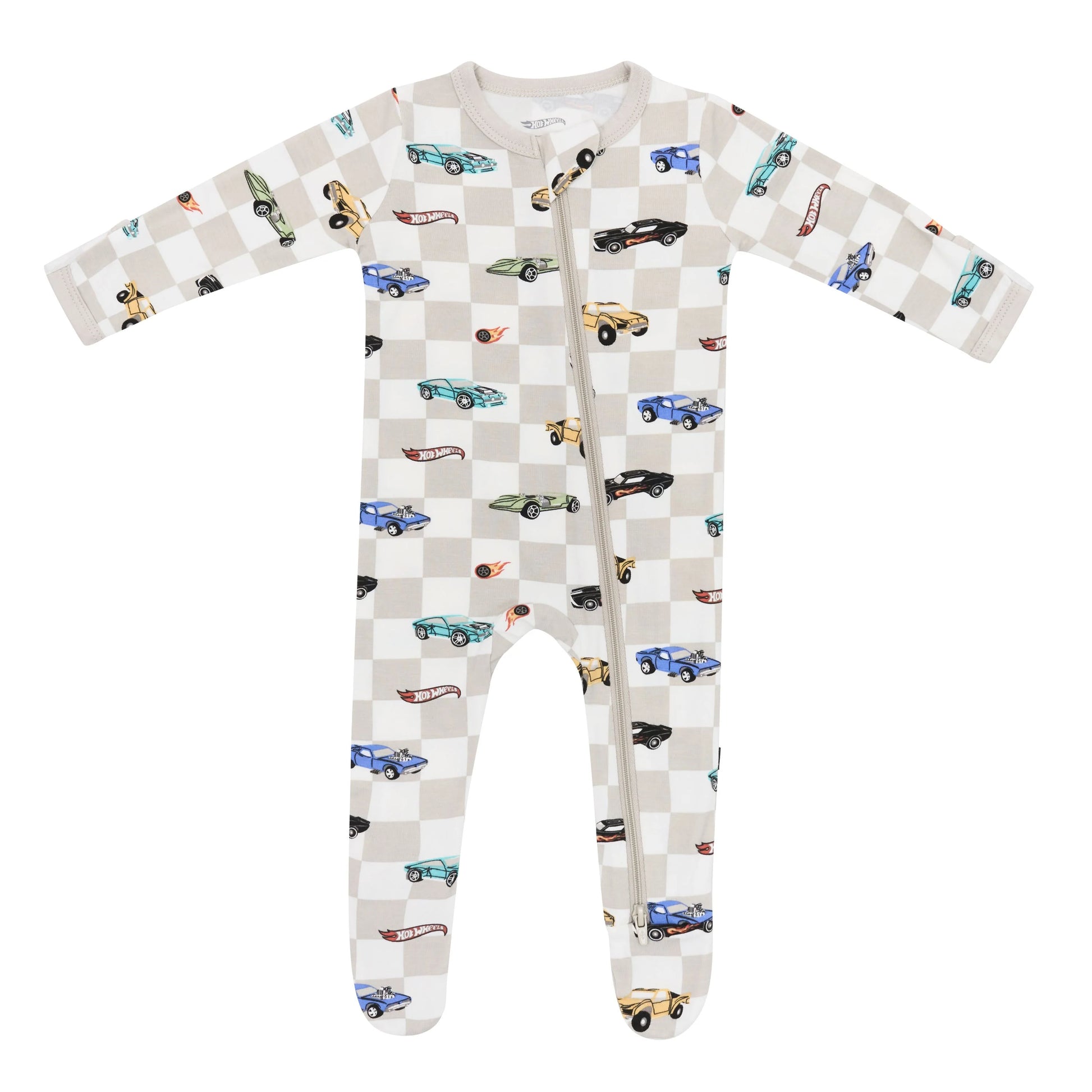 Kyte Baby zippered footie in Fast and Fierce print, soft fabric, with front zipper and enclosed feet for cozy comfort.