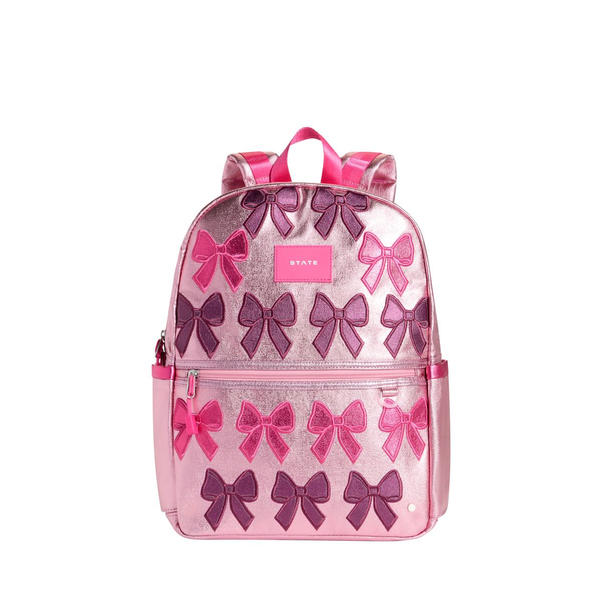 Patchwork Bow Kane Backpack by State Bags featuring a colorful patchwork design and bow detail on the front.
