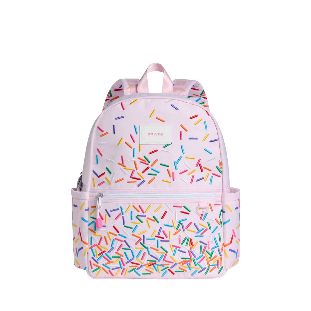 State Bags Sprinkles Kane Backpack in colorful fabric with multiple compartments and adjustable straps.