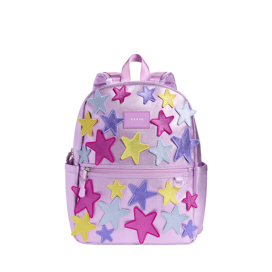 State Bags 3D Stars Kane Backpack showing navy blue fabric with colorful star patterns and adjustable shoulder straps.