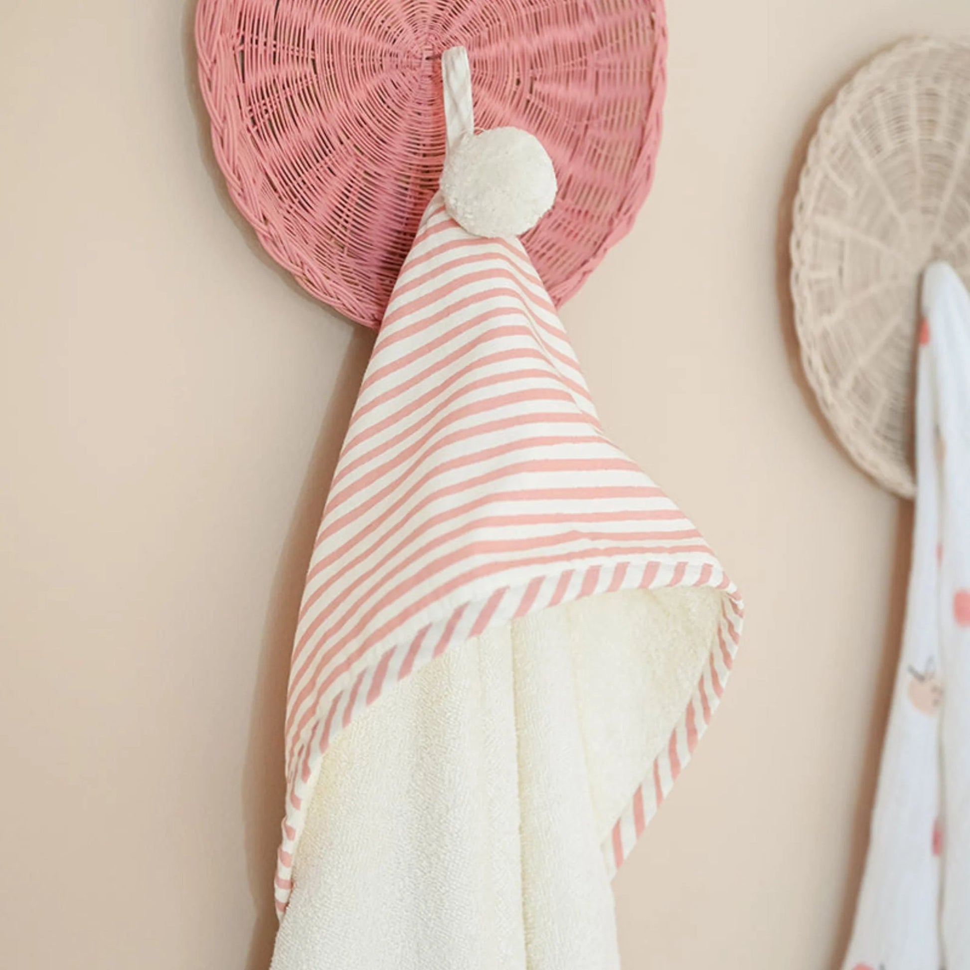 Pehr Stripes Away Petal hooded towel featuring colorful striped design and a cozy hood for drying and wrapping a pet or child.